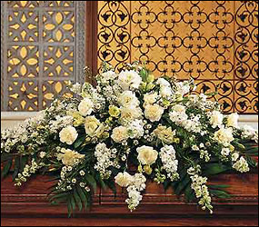 Pure White Casket Spray from Clifford's where roses are our specialty