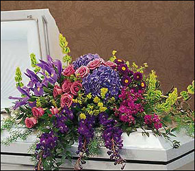 Graceful Tribute Casket Spray from Clifford's where roses are our specialty